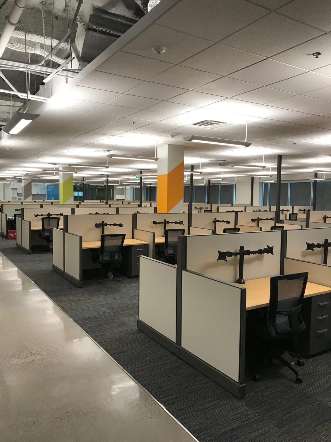An office space with empty cubicles